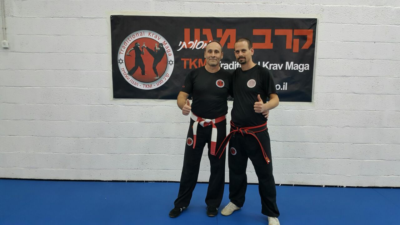A new Dan 4 black belt in TKM training staff
